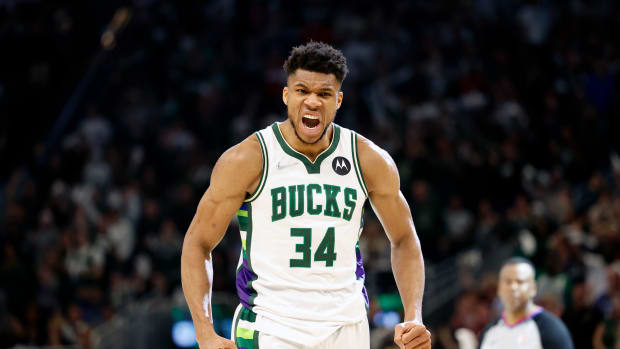 Giannis Antetokounmpo reacts after a made shot.