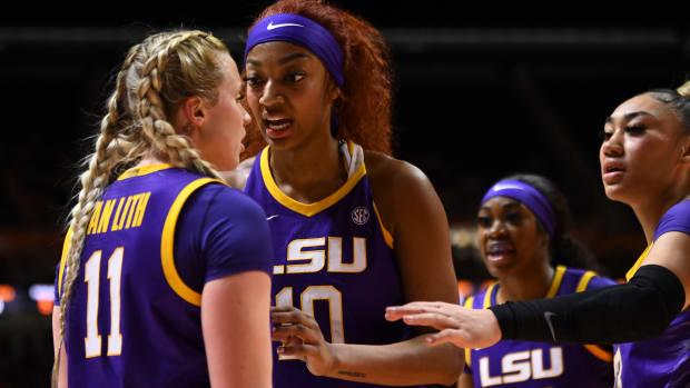 LSU Tigers teammates Angel Reese and Hailey Van Lith talk during a timeout.