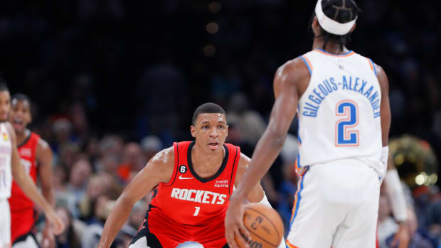 Rockets forward Jabari Smith Jr. defends Oklahoma City Thunder guard Shai Gilgeous-Alexander