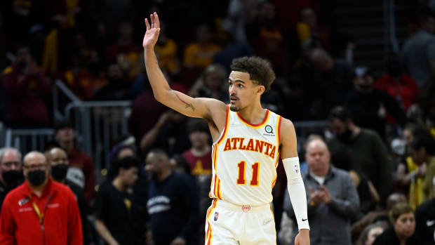 Trae Young waves to Cleveland fans after a win.