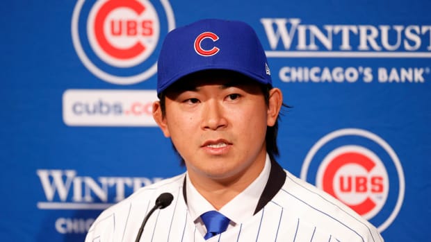 Jan 12, 2024; Chicago, IL, USA; Chicago Cubs newly signed pitcher Shota Imanaga (center) speaks during a press conference at Loews Chicago Hotel.