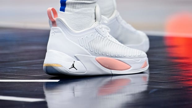 View of Luka Doncic's white and pink shoes.