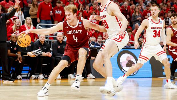 Wisconsin forward Ben Carlson defending his man against Colgate.