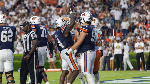 Tank Bigsby celebrates with Tate Johnson after scoring a touchdown against Mercer.