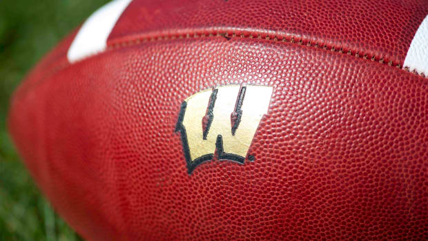 A football with the Wisconsin Badgers logo on it (Credit: Jeff Hanisch-USA TODAY Sports)