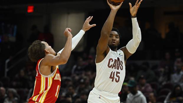 Donovan Mitchell shoots over Trae Young.