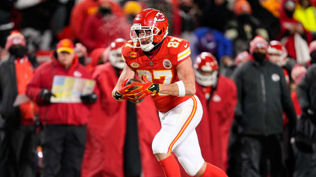 Kansas City Chiefs tight end Travis Kelce runs with the football.