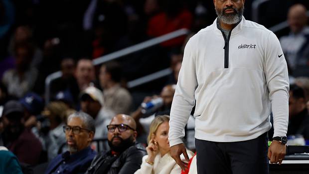 Washington Wizards head coach Wes Unseld Jr. looks on from the bench against the Philadelphia 76ers in the second quarter at Capital One Arena.