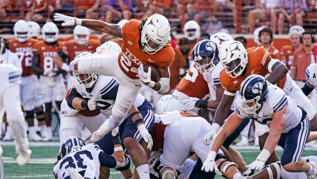 Oct 28, 2023; Austin, Texas, USA; Texas Longhorns running back Jonathon Brooks (24) leaps over Brigham Young Cougars defenders during the second half at Darrell K Royal-Texas Memorial Stadium.  