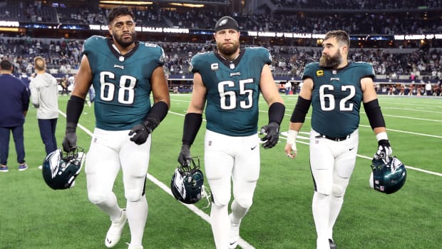 Philadelphia Eagles offensive tackle Jordan Mailata (68) and offensive tackle Lane Johnson (65) and center Jason Kelce (62) walk off the field after the game against the Dallas Cowboys at AT&T Stadium.