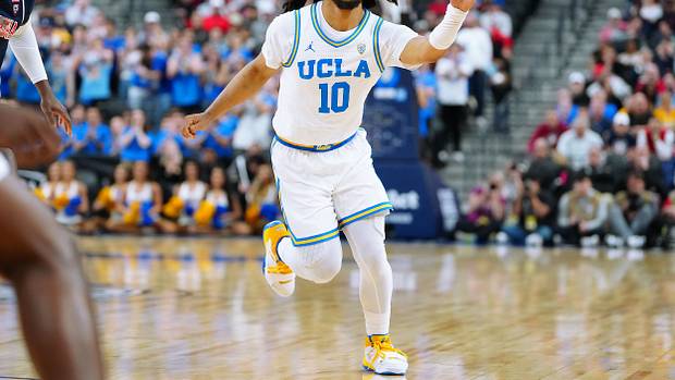 UCLA Bruins guard Tyger Campbell passes the ball.