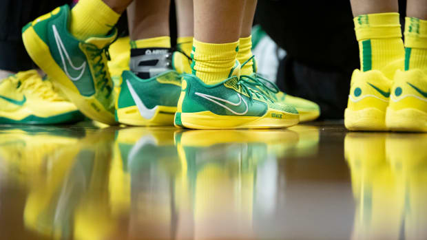 Side view of Sabrina Ionescu's green and yellow Nike sneakers.