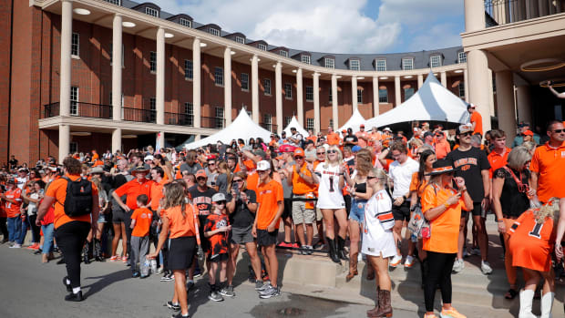 Sep 16, 2023; Stillwater, Oklahoma, USA; Oklahoma State Cowboys fans cheer as the team arrives before a game against the South Alabama Jaguars at Boone Pickens Stadium. Mandatory Credit: Bryan Terry-USA TODAY Sports