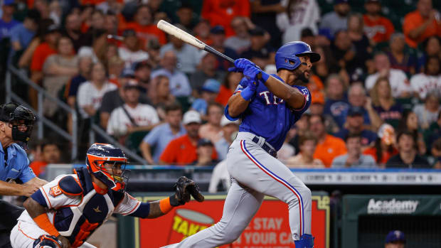 Aug 10, 2022; Houston, Texas, USA; Texas Rangers center fielder Leody Taveras (3) hits an RBI triple during the fourth inning against the Houston Astros at Minute Maid Park. Mandatory Credit: Troy Taormina-USA TODAY Sports