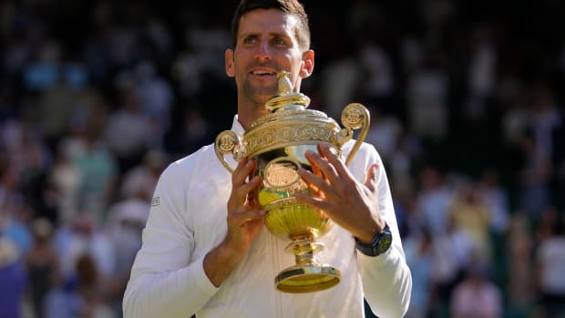 Novak Djokovic celebrates his latest Wimbledon win.