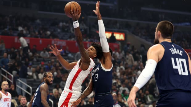 Houston Rockets guard Jalen Green defended by LA Clippers star Paul George.