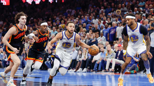 Golden State Warriors guard Stephen Curry dribbles to the basket against the Oklahoma City Thunder.