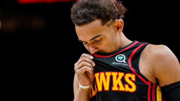 Atlanta Hawks guard Trae Young looks down during a game.