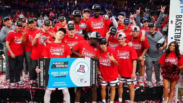The Arizona Wildcats celebrate after winning the conference championship.