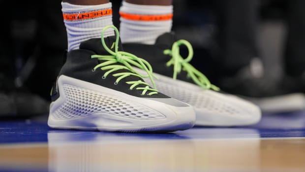 Minnesota Timberwolves guard Anthony Edwards' white and black adidas sneakers.