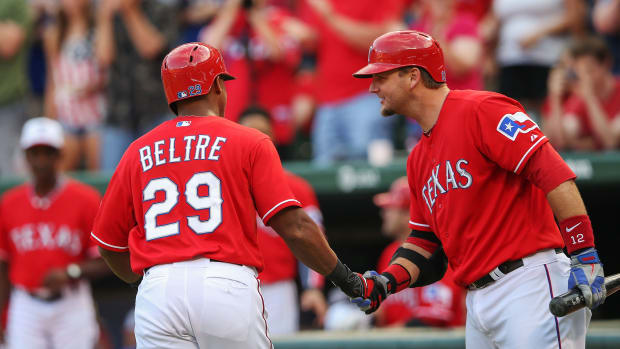 Former Texas Rangers catcher A.J. Pierzynski, right, congratulates third baseman Adrian Beltre for hitting a home run during a game in 2013.