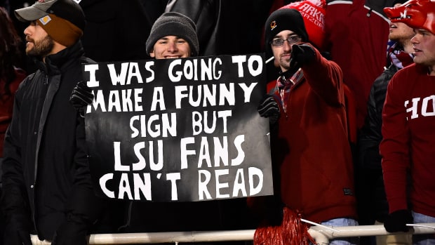 A fan holds up a sign during the second half of the game between the Arkansas Razorbacks and the LSU Tigers at Donald W. Reynolds Razorback Stadium. The Arkansas Razorbacks defeat the LSU Tigers 17-0.