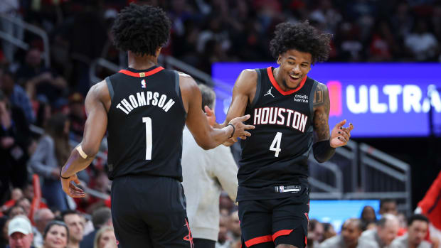 ockets guard Jalen Green (4) celebrates with forward Amen Thompson (1) after a play during the second quarter against the Washington Wizards at Toyota Center.