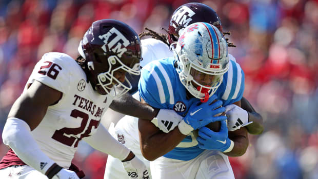 Nov 4, 2023; Oxford, Mississippi, USA; Mississippi Rebels wide receiver Tre Harris (9) runs after a catch against Texas A&M Aggies defensive back Demani Richardson (26) and defensive back Sam McCall (16) during the first half at Vaught-Hemingway Stadium. Mandatory Credit: Petre Thomas-USA TODAY Sports