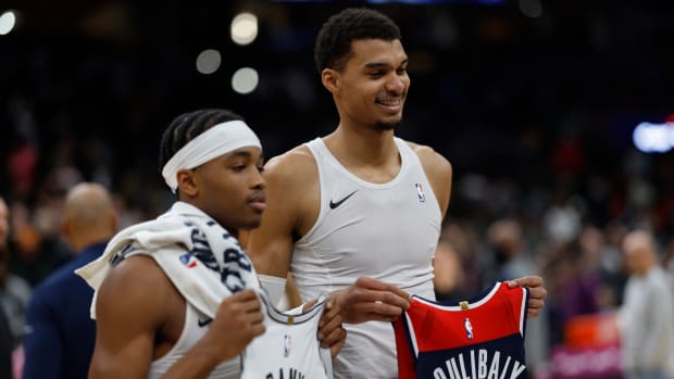 Washington Wizards guard Bilal Coulibaly (L) and San Antonio Spurs center Victor Wembanyama (R) swap jerseys after their game at Capital One Arena. Mandatory Credit: Geoff Burke-USA TODAY Sports