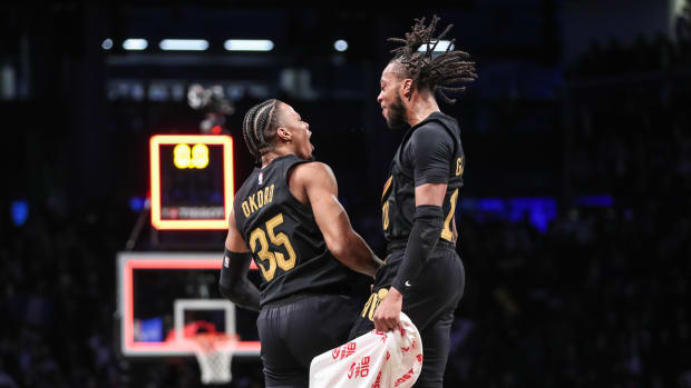 Mar 23, 2023; Brooklyn, New York, USA; Cleveland Cavaliers forward Isaac Okoro (35) celebrates with guard Darius Garland (10) after scoring the game wining basket to beat the Brooklyn Nets 116-114 at Barclays Center. Mandatory Credit: Wendell Cruz-USA TODAY Sports