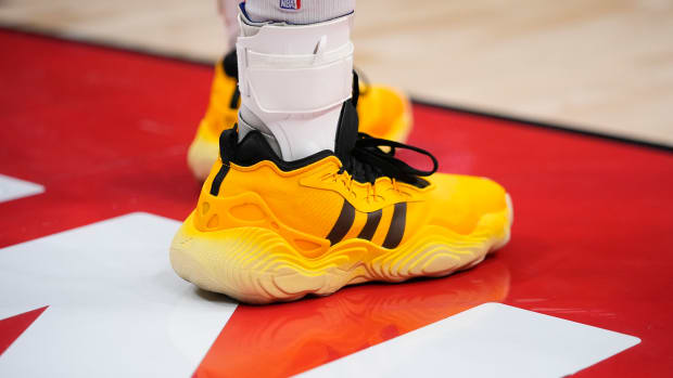 Atlanta Hawks guard Trae Young's yellow and black adidas sneakers.