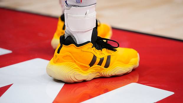 Atlanta Hawks guard Trae Young's yellow and black adidas sneakers.