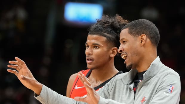 Former Rockets head coach Stephen Silas talks to guard Jalen Green at a NBA game against the Toronto Raptors at Scotiabank Arena.