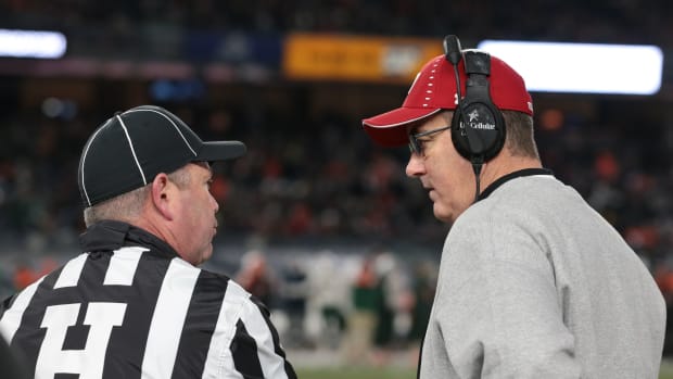 Paul Chryst speaking with a referee during the Pinstripe Bowl (Credit: Vincent Carchietta, Vincent Carchietta-USA TODAY Sports)