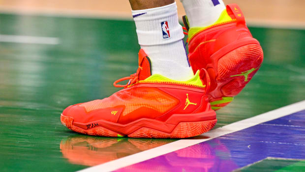 View of Russell Westbrook's red and yellow Jordan Brand shoes.