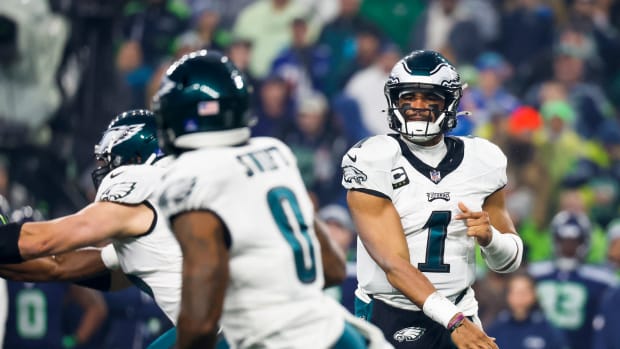 Philadelphia Eagles quarterback Jalen Hurts (1) passes against the Seattle Seahawks during the first quarter at Lumen Field.