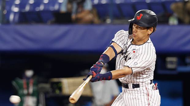Team Japan outfielder Masataka Yoshida hits a single against Korea during the Tokyo Olympics. (2021)