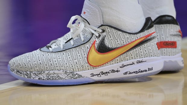 Grey Nike LeBron 20 shoes.