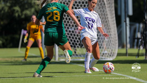Gracie Brian (17) chases down the ball to keep it in play for TCU.