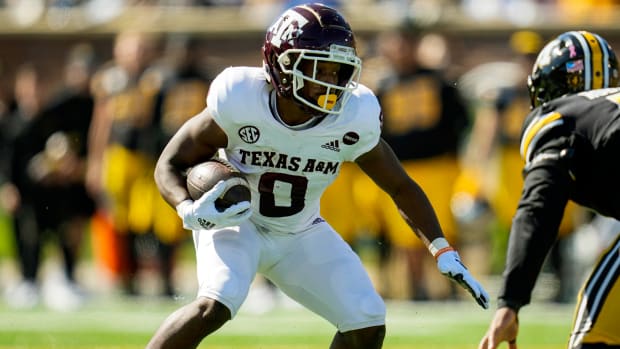 Texas A&M wide receiver Ainias Smith was arrested on weapons and marijuana charges ahead of SEC Media Days.