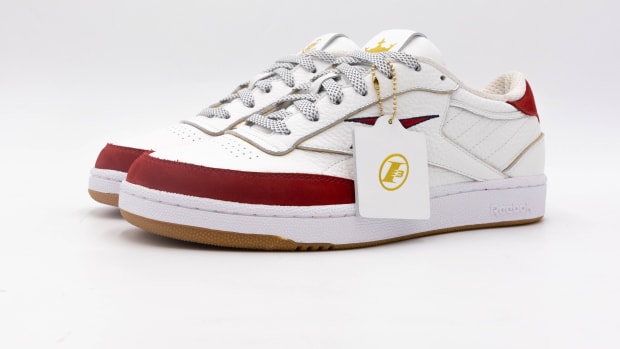 Side view of Allen Iverson's white and red Reebok sneakers.