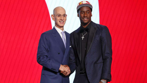 A.J. Griffin (Duke) shakes hands with NBA commissioner Adam Silver after being selected as the number sixteen overall pick by the Atlanta Hawks in the first round of the 2022 NBA Draft at Barclays Center.