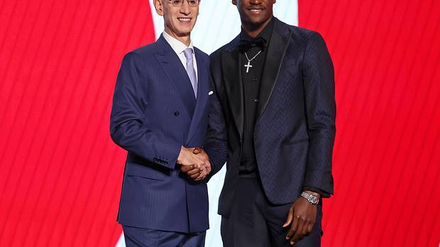 A.J. Griffin (Duke) shakes hands with NBA commissioner Adam Silver after being selected as the number sixteen overall pick by the Atlanta Hawks in the first round of the 2022 NBA Draft at Barclays Center.