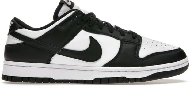 Side view of black and white Nike Dunk shoes.