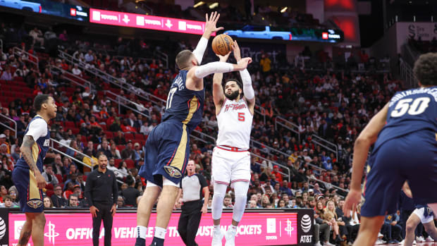 Rockets guard Fred VanVleet (5) shoots the ball as New Orleans Pelicans center Jonas Valanciunas (17) defends during the fourth quarter at Toyota Center.