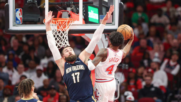 Pelicans center Jonas Valanciunas (17) defends as Houston Rockets guard Jalen Green (4) attempts to score during the second quarter at Toyota Center.