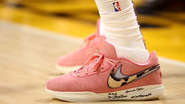View of pink and white Nike LeBron shoes.