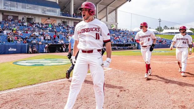 Arkansas outfielder Jared Wegner celebrates a grand slam against Texas A&M in the second round of the SEC Tournament in Hoover, Alabama.