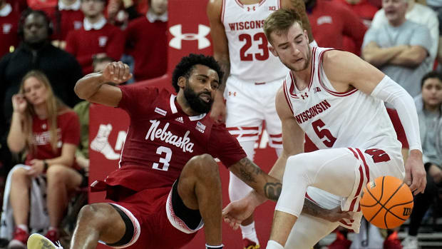 Nebraska guard Brice Williams (3) is fouled by Wisconsin forward Tyler Wahl (5) during the second half of their game Saturday, January 6, 2024 at the Kohl Center in Madison, Wisconsin. Wisconsin beat Nebraska 88-72.  