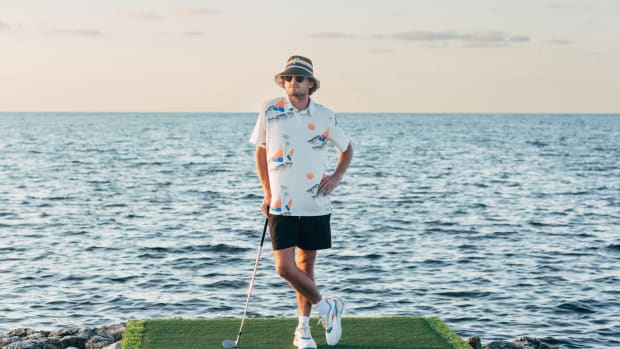 Rickie Fowler models Puma golf apparel on the beach.